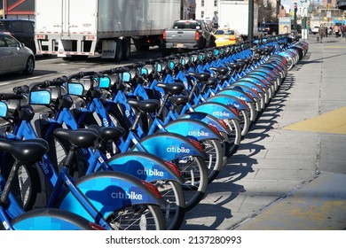 Brooklyn, NY; Circa 2022: Citibike Ride Share Bicycle Rack Outside On Sidewalk During Morning Commute. New York Commute Traffic Passes By On  Avenue In Background