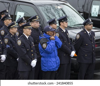 Brooklyn, NY - January 04, 2015: Police Officers Cry Outside Aievoli Funeral Home For The Funeral Of Slain New York City Police Officer Wenjian Liu