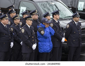 Brooklyn, NY - January 04, 2015: Police Officers Cry Outside Aievoli Funeral Home For The Funeral Of Slain New York City Police Officer Wenjian Liu