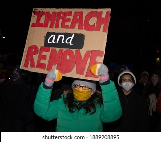 BROOKLYN, N.Y. – January 7, 2021: An anti-Trump demonstrator is seen outside the Barclays Center in Brooklyn.