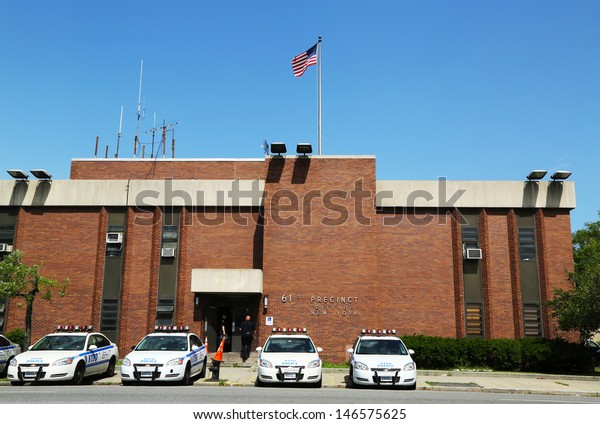 BROOKLYN, NY- JULY 14: Police cars in the front of NYPD\
61st Precinct in Brooklyn , NY on July 14, 2013. The New York\
Police Department, established in 1845, is the largest police force\
in USA 
