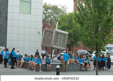 Brooklyn NY July 18 2019 Jewish Children Outside The Jewish Children Museum On A Hot Summer Day In Brooklyn With A Jewish Symbol In Metal In The Middle