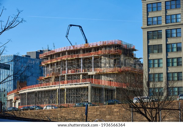 Brooklyn,\
NY - March 10 2021: The construction of a new apartment tower at 30\
Front Street in DUMBO, Brooklyn, NY. The 26-story mixed-use\
building was designed by Hill West Architects\
