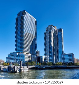 Brooklyn, NY - October 17 2020: Two contemporary high-rise apartment towers, Level and The Edge, line the East River waterfront in in North Williamsburg, Brooklyn, NY