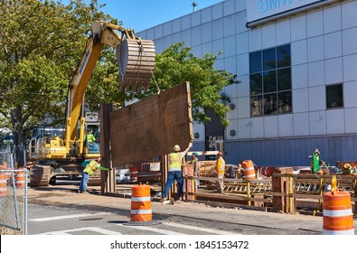 Brooklyn, NY - September 30 2020: Workmen Install Trench Shoring On An Excavation On Second Avenue In Sunset Park Shoring Is A Process Of Bracing The Walls Of A Trench To Prevent Collapse