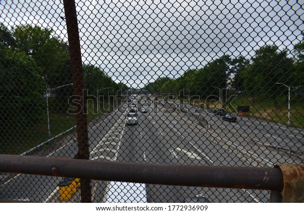 Brooklyn, NY, US - July 7, 2020: Cars on the\
Brooklyn Queens Expressway go north from Staten Island as traffic\
begins to return to normal in New York\'s phase 3 reopening from the\
COVID-19 pandemic.