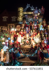 Brooklyn, NY, USA - December 13, 2016: Night View Of Houses With Christmas Lights In The Suburban Brooklyn Neighborhood Of Dyker Heights.