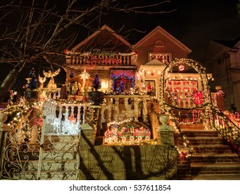 Brooklyn, NY, USA - December 13, 2016: Night View Of Houses With Christmas Lights In The Suburban Brooklyn Neighborhood Of Dyker Heights.