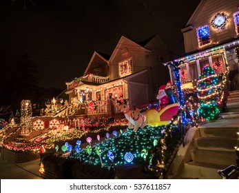 Brooklyn, NY, USA - December 13, 2016: Night View Of Houses With Christmas Lights In The Suburban Brooklyn Neighborhood Of Dyker Heights.