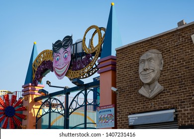 Brooklyn NY - USA - May 22 2019: Coney Island Clown Face Sign On The Wall And Luna Park In Coney Island