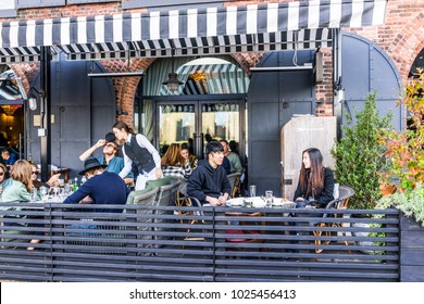 Brooklyn, USA - October 28, 2017: Dumbo Outside Exterior Outdoors In NYC New York City, People Sitting Eating In Italian Restaurant Cecconis