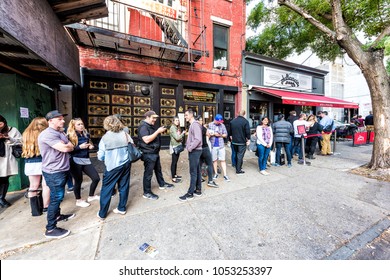 Brooklyn, USA - October 28, 2017: Long Line Queue Of People Crowd Waiting For Famous Restaurant Food Called Juliana's Pizza