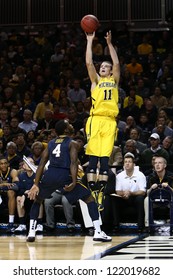 BROOKLYN-DEC 15: Michigan Wolverines Guard Nik Stauskas (11) Shoots Over West Virginia Mountaineers Guard Jabarie Hinds (4) During The First Half At Barclays Center On December 15, 2012 In Brooklyn.