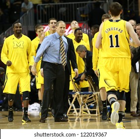 BROOKLYN-DEC 15: Michigan Wolverines Head Coach John Beilein (R) Reacts With Players Against The West Virginia Mountaineers At Barclays Center On December 15, 2012 In Brooklyn.