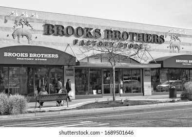 Brooks Brothers Factory Store. Building Exterior. Storefront. People Walk Along The Street. Atlantic City. Urban Cityscape. Black & White Photography. USA, Atlantic City – November 23, 2019 