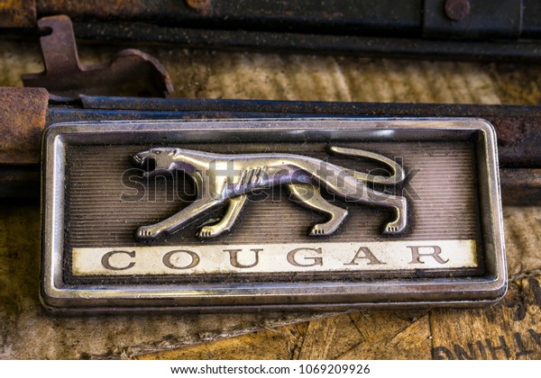 Brooks, Oregon/USA - March 14, 2018:  An old cougar\
car sign in an auto\
shop.