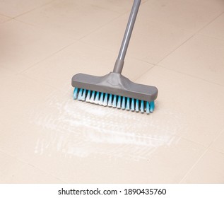 Broom Cleaning Ceramic Tile Floor In Bathroom