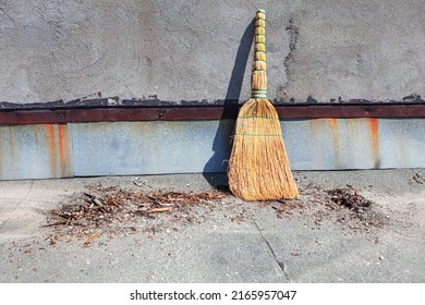 Broom and waste . Natural straw hand broom - Shutterstock ID 2165957047