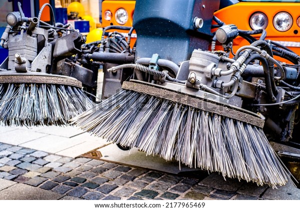 brooms of a street\
cleaning car - photo