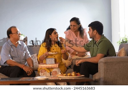 Similar – Man holding hot dog in barbecue with friends