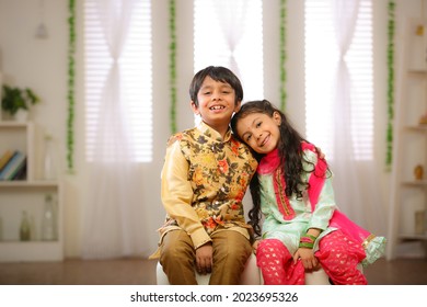 brother sister celebrating rakhi festival at home  - Shutterstock ID 2023695326