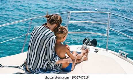 Brother And Sister Enjoy Yachting Cruise. Summer Vacation For Family At Luxury Yacht.