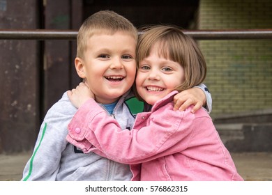 Brother And Sister Are  Hugging