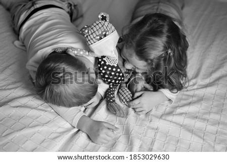 Similar – Little girl holding cookie sitting over the bed