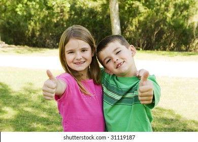 Brother And Sister Playing Outside