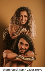 Brother And Sister Posing With Bearded Dragon And Dumeril's Boa At The Studio