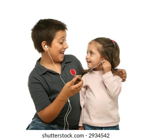 Brother and sister sharing a mp4 player - Powered by Shutterstock