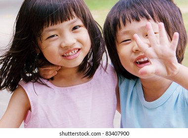 Brother and Sister showing hands to stop