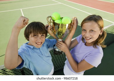 Brother And Sister With Tennis Trophy