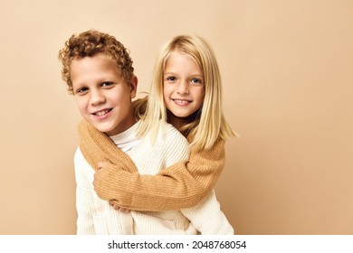 brother and sister together in sweaters fun casual wear Studio Lifestyle - Shutterstock ID 2048768054