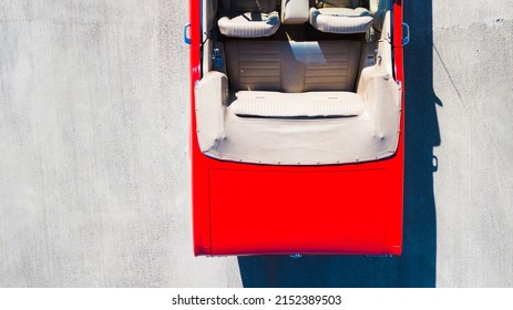 BROWARD, UNITED STATES - Mar 21, 2022: A Top View Of A Red 1966 Convertible Ford Mustang With Pony Seats