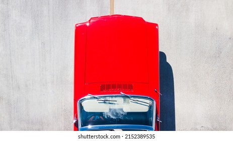 BROWARD, UNITED STATES - Mar 21, 2022: A Top View Of Red 1966 Convertible Ford Mustang With Shiny Bonnet, Broward, USA