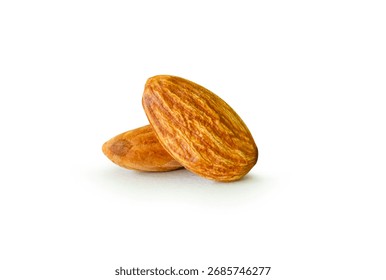 Brown almond nuts in stack are isolated on white background with clipping path.