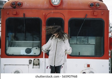Brown attractive girl raised in the coach of train - Shutterstock ID 565907968