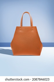 Brown bag on a blue background with clipping mask - Shutterstock ID 2087846023