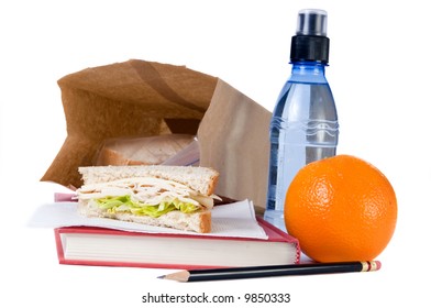 A Brown Bag School Lunch, With Fruit And Water