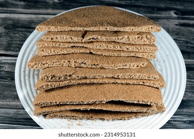 Brown baked pitta bread flatbread made mainly in bran, Bran breads used for sandwiches and beside meals, popular in Egypt, brown circular and round baked bran breads, selective focus - Shutterstock ID 2314953131
