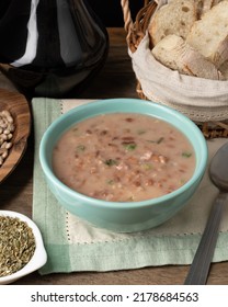 Brown Bean Soup In A Bowl With Bread And Wine.