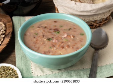 Brown Bean Soup In A Bowl With Bread And Wine.