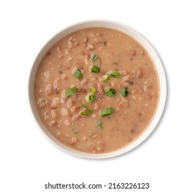 Brown Bean Soup In A Bowl Isolated Over White Background.