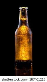 Brown beer bottle with drops