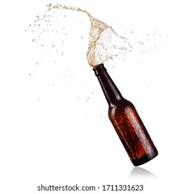 Brown beer bottle with drops splash, close up