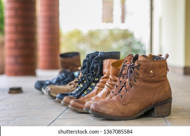 Brown and black shoes is waiting on the terrace for polishing during the spring time - Shutterstock ID 1367085584