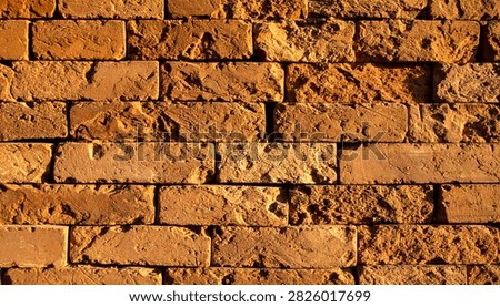 Brown block brick wall seamless texture with unpainted masonry pattern, rustic architectural surface and natural earthy background.