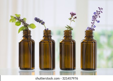 brown bottle  with aromatic herbs for essential oil