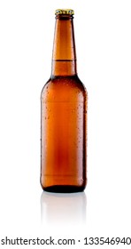 Brown bottle of beer with drops on a white background